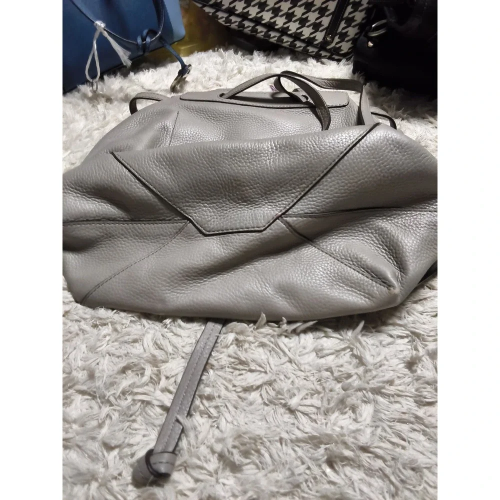 15.Michael Kors Grey Pebbled Leather Drawstring Backpack Flap Bag Silver MK Logo
